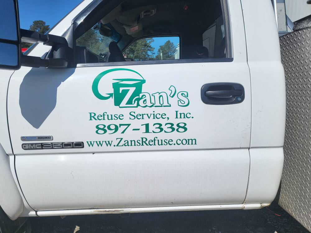 side view of branded work truck wrap near Short Pump Town Center Richmond